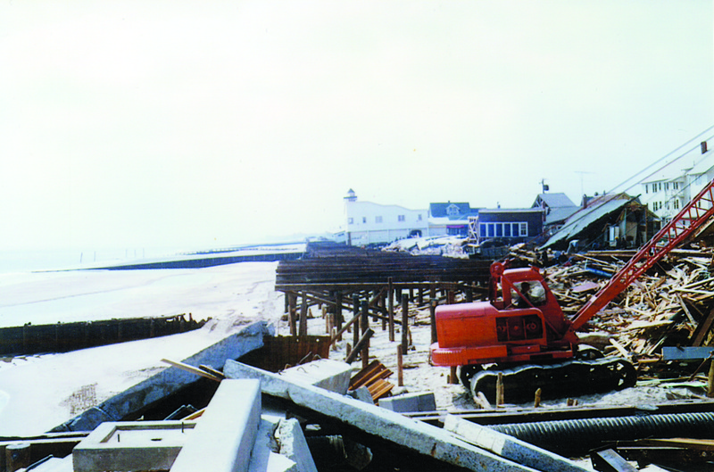 Work starts on rebuilding amid the ruins on the Rehoboth Beach Boardwalk. In the distance is Playland, one of the few structures left standing. MARIE QUILLEN PHOTO